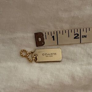 Coach hang tag with protective film